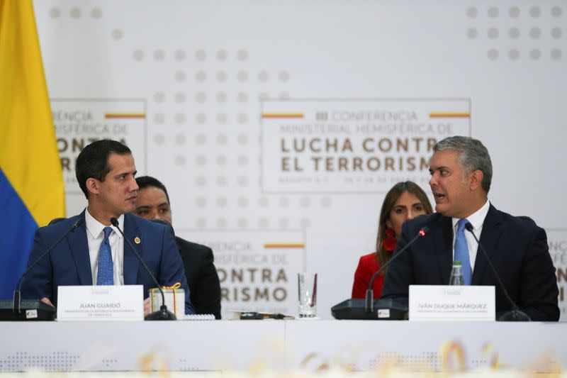 Colombia's President Duque speaks next to Venezuelan opposition leader Guaido during the III Hemispheric Anti-Terrorism Ministerial Conference at the Francisco de Paula Santander General Police Cadet School, in Bogota