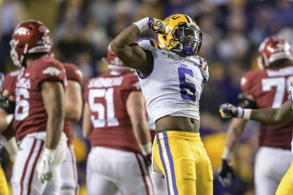 LSU linebacker Jacob Phillips (6) celebrates a sack of Arkansas quarterback K.J. Jefferson (1) during the first half of an NCAA college football game in Baton Rouge, La., Saturday, Nov. 23, 2019. (AP Photo/Matthew Hinton)