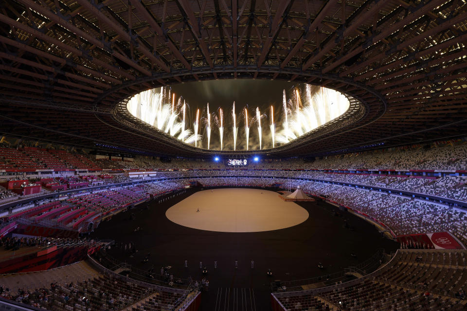 <p>TOKYO, JAPAN - JULY 23: General view inside the stadium as fireworks are seen during the Opening Ceremony of the Tokyo 2020 Olympic Games at Olympic Stadium on July 23, 2021 in Tokyo, Japan. (Photo by Ezra Shaw/Getty Images)</p> 