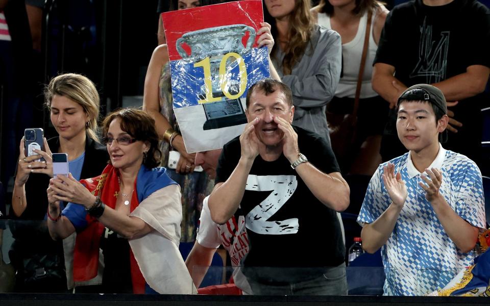 A spectator wears a 'Z' on his t-shirt as he cheers for Novak Djokovic of Serbia taking on Andrey Rublev of Russia in their quarterfinal match at the 2023 Australian Open tennis tournament in Melbourne - Pro-Russia protestors storm Australian Open with Putin and ‘Z’ banners - Fazry Ismail /Shutterstock