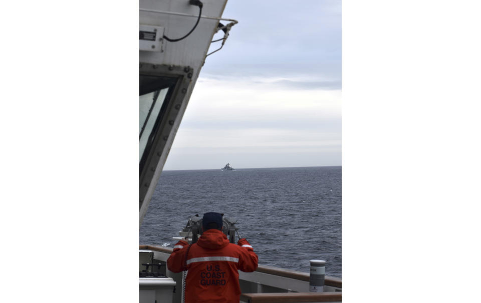 FILE -In this photo provided by the U.S. Coast Guard, a Coast Guard Cutter Kimball crew-member observes a foreign vessel in the Bering Sea, Sept. 19, 2022. A U.S. Coast Guard cutter on routine patrol in the Bering Sea came across several Chinese military ships in international waters but within the U.S. exclusive economic zone, officials said Wednesday, July 10, 2024. (U.S. Coast Guard District 17 via AP), File)