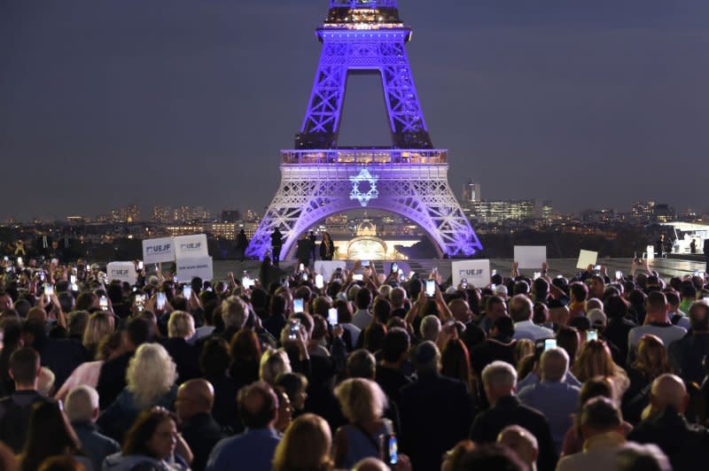 The Eiffel Tower is illuminated with the colors of the Israeli flag and its Star of David in support of the Jewish State in Paris, on Monday. The tower was illuminated after a demonstration in support for Israel in the aftermath of Hamas Islamic group's devastating surprise attack from Gaza. Photo by Maya Vidon-White/UPI