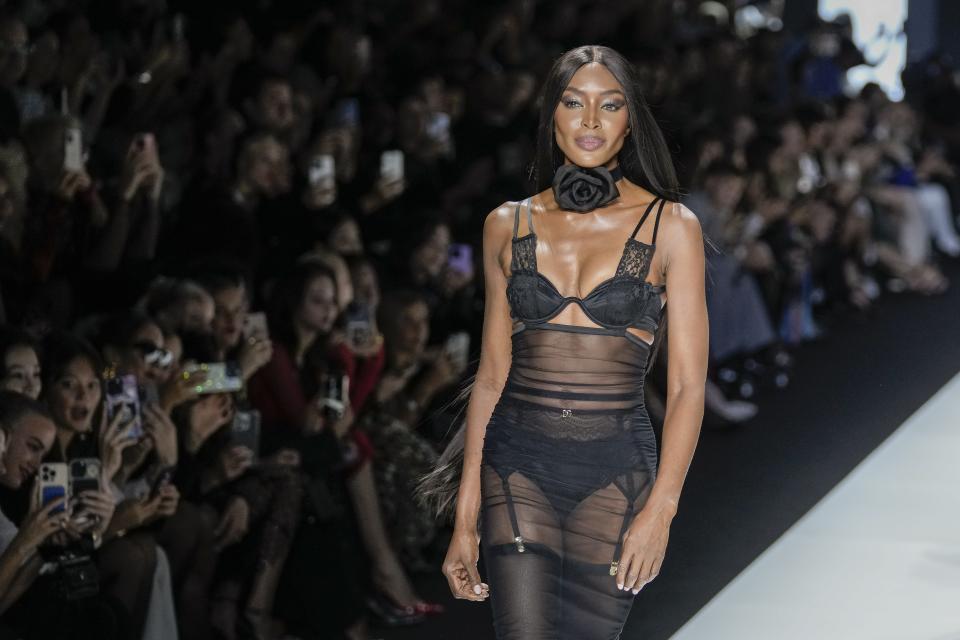 Naomi Campbell wears a creation as part of the Dolce & Gabbana women's Spring Summer 2024 collection presented in Milan, Italy, Saturday, Sept. 23, 2023. (AP Photo/Antonio Calanni)