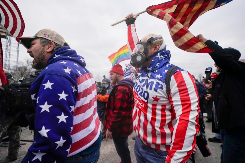 Rioters shout at the U.S. Capitol on Jan. 6, 2021, in Washington. The Jan. 6, 2021 insurrection at the U.S. Capitol played out for the world to see. But the House committee investigating the attack believes a more chilling story has yet to be told.