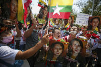 FILE - In this March 7, 2021, file photo, Myanmar nationals living in Thailand hold pictures of deposed Myanmar leader Aung San Suu Kyi as they protest against the military coup in front of the United Nations building in Bangkok, Thailand. The military takeover of Myanmar early in the morning of Feb. 1 reversed the country's slow climb toward democracy after five decades of army rule. But Myanmar's citizens were not shy about demanding their democracy be restored. (AP Photo/Nava Sangthong, File)