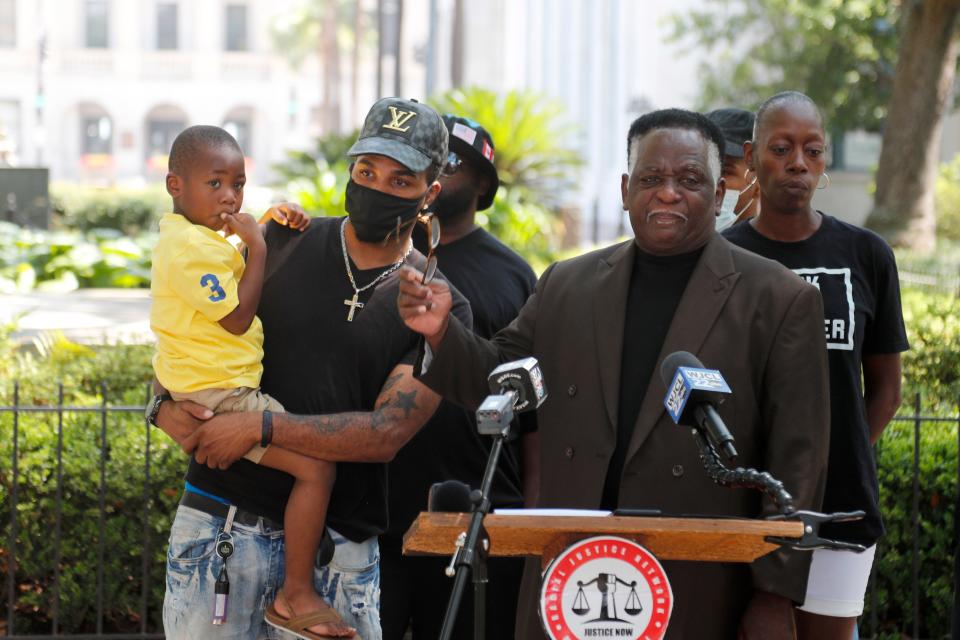 James Johnson, the CEO of Racial Justice Network, talks about the loss Maurice Mincey's family has suffered as a result of his death during a traffic stop by Savannah Police. Mincey's brother, Domonique holds Maurice's son during the press conference in Johnson Square.