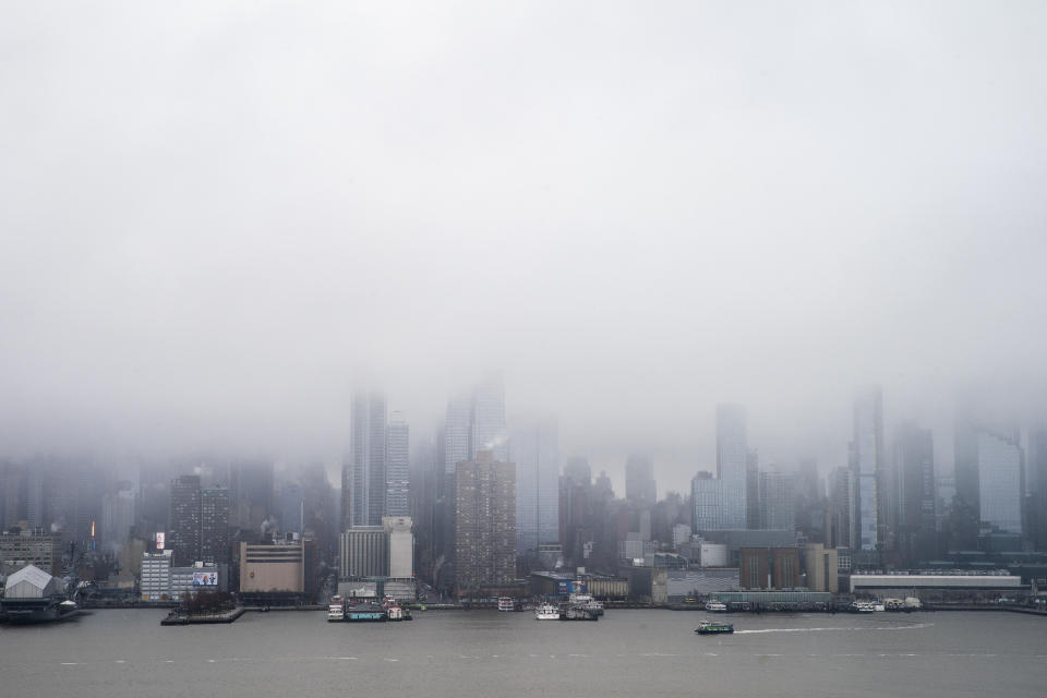 The Skyline of Middle Manhattan and the Empire State Building are seen covered during a winter storm in New York as it is seen from Weehawken, New Jersey. Sunday, Jan. 7, 2024. (AP Photo/Eduardo Munoz Alvarez)