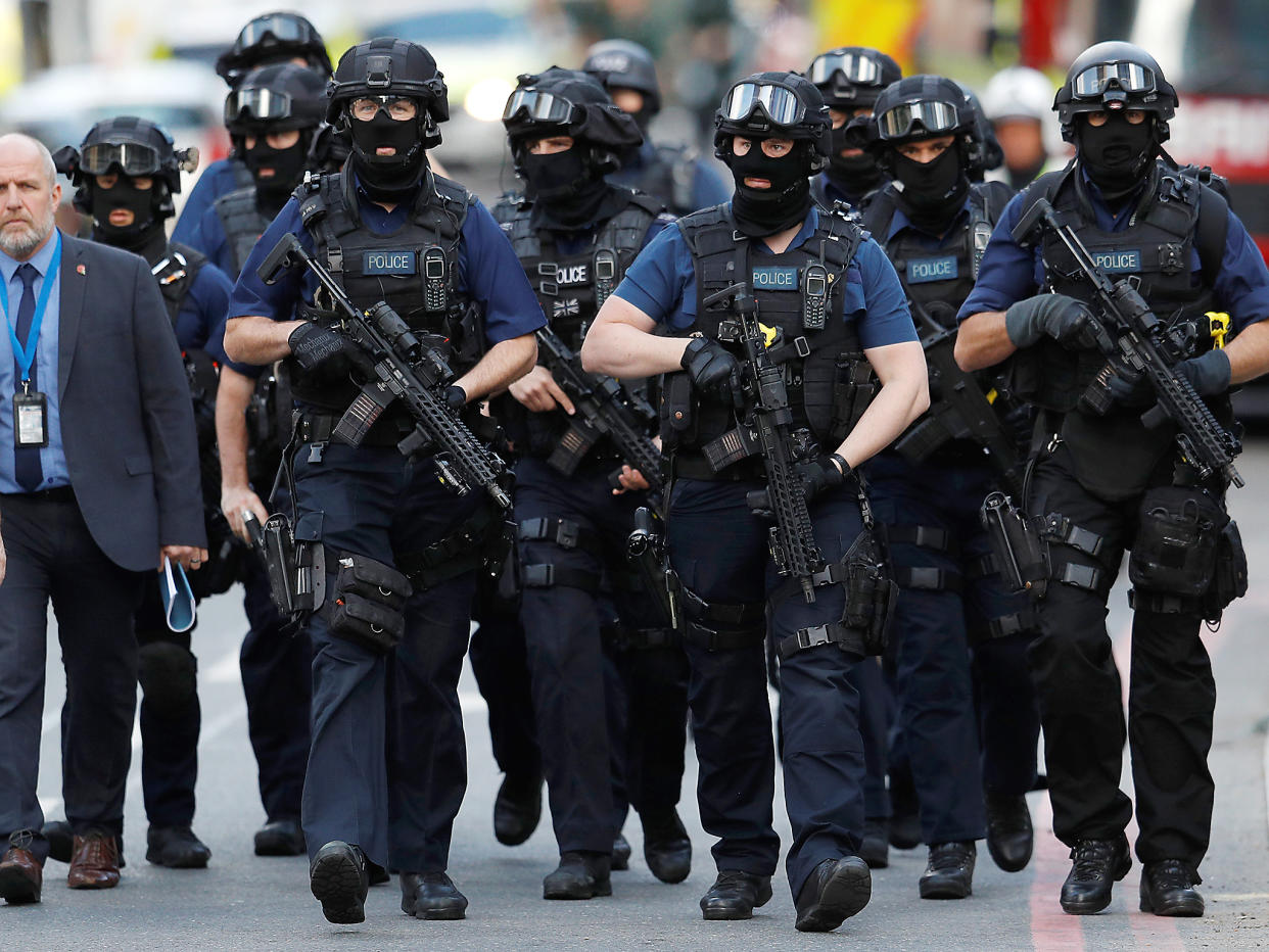 Armed police officers walk outside Borough Market after an attack left 6 people dead and dozens injured in London: REUTERS/Peter Nicholls