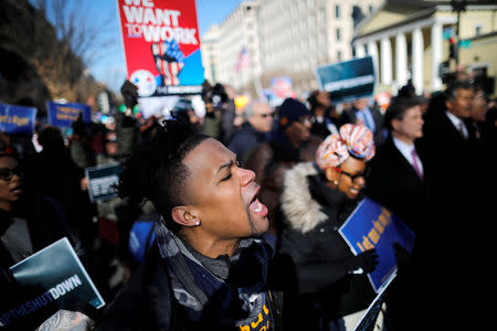 U.S. federal government employees, contract workers and other demonstrators march during a “Rally to End the Shutdown” in Washington, U.S., January 10, 2019. REUTERS/Carlos Barria