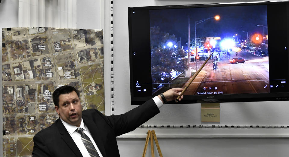 James Armstrong, of the state crime lab, points to drone video he digitally enlarged during Kyle Rittenhouse's trial at the Kenosha County Courthouse in Kenosha, Wis., on Tuesday, Nov. 9, 2021. Rittenhouse is accused of killing two people and wounding a third during a protest over police brutality in Kenosha, last year. (Sean Krajacic/The Kenosha News via AP, Pool)