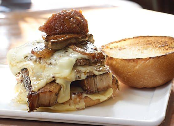 <b>Maine: Apocalypse Now Burger</b> Pork belly, cheese, bacon, foie gras and mayo top this outrageous burger.<br> <br> (Image courtesy Nosh Kitchen Bar)
