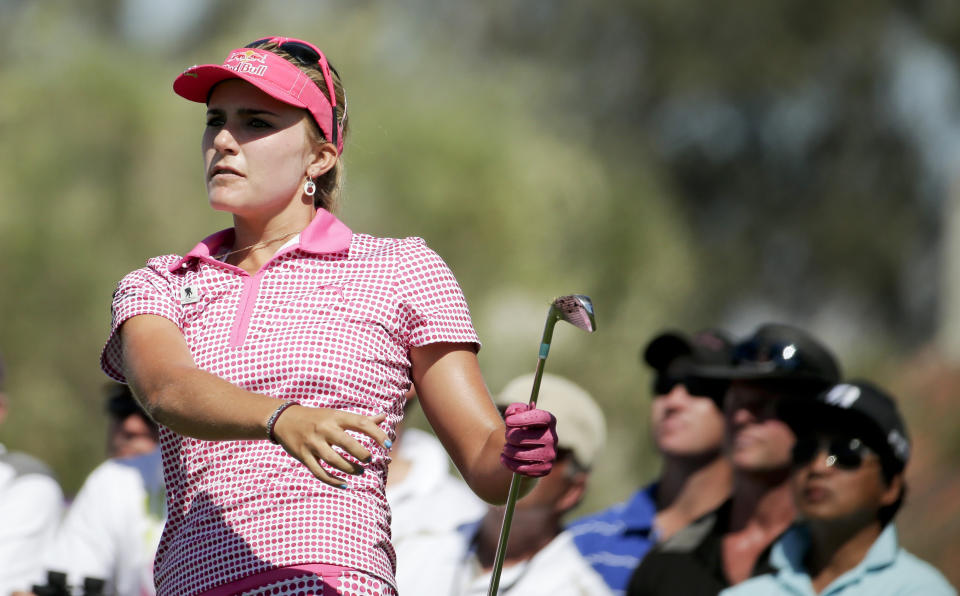 Lexi Thompson watches her tee shot on the fifth hole during the third round of the Kraft Nabisco Championship golf tournament Saturday, April 5, 2014, in Rancho Mirage, Calif. (AP Photo/Chris Carlson)