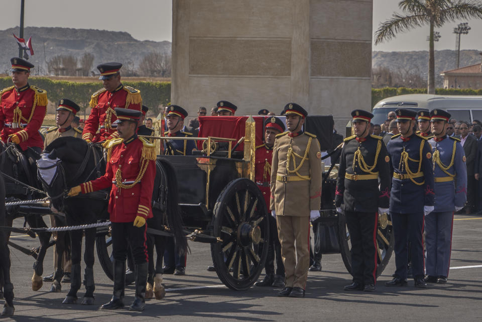 A horse-drawn carriage carries the flag-draped coffin of former autocratic President Hosni Mubarak during his funeral at Tantawi Mosque, in eastern Cairo, Egypt, Wednesday, Feb. 26, 2020. Egypt is holding a full-honors military funeral for Mubarak who was ousted from power in the 2011 Arab Spring uprising. The 91-year-old Mubarak died on Tuesday at a Cairo military hospital from heart and kidney complications. (AP Photo/Hamada Elrasam)