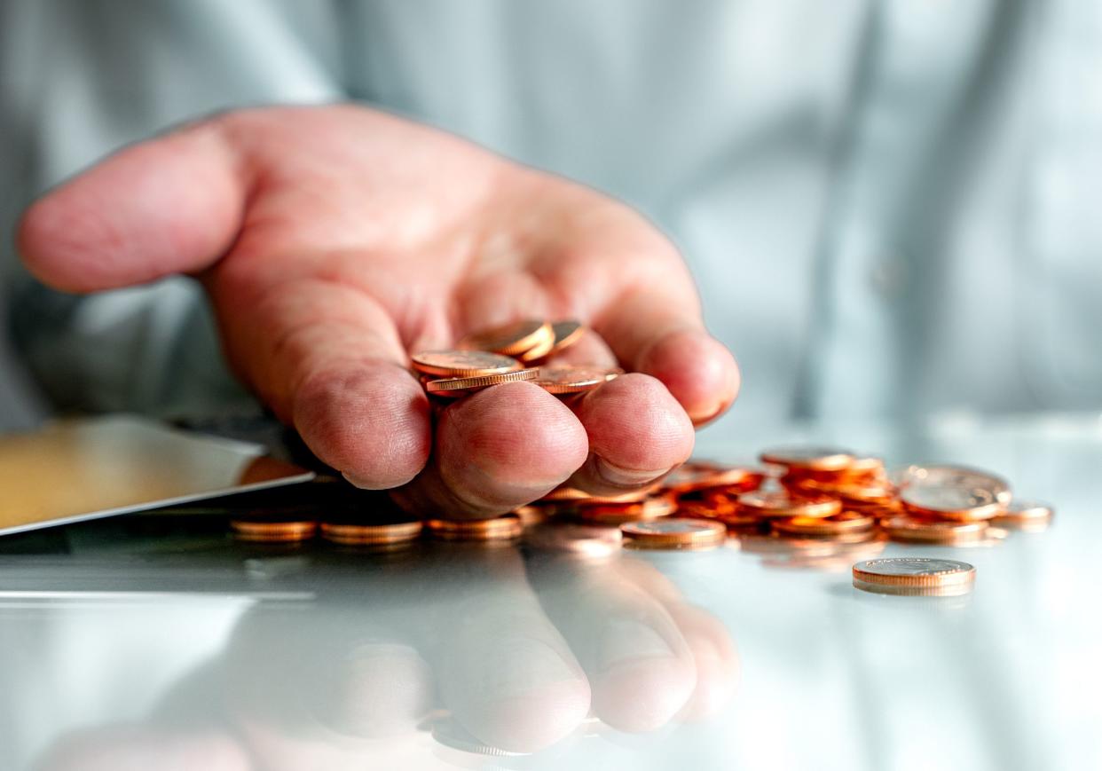 Selective focus of copper coins on hand , Concept for money and business