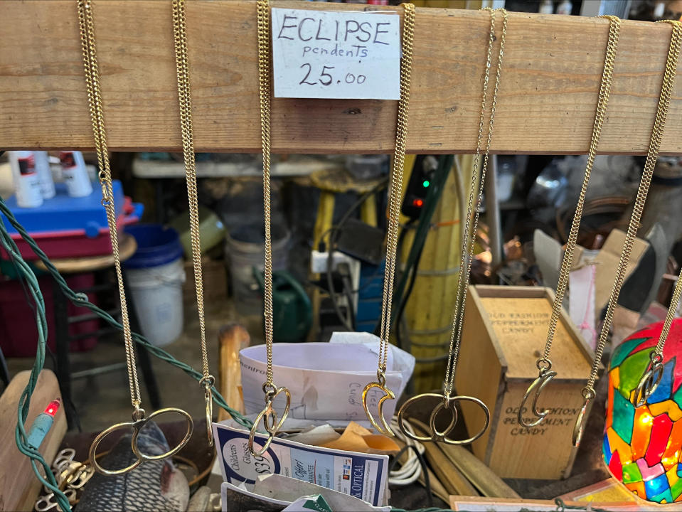 Eclipse pendants created by artist Dave Dardis for sale in Makanda, Illinois. / Credit: Roxana Saberi/CBS News