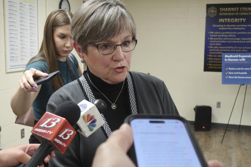 Kansas Gov. Laura Kelly speaks to reporters following a public event, Tuesday, April 16, 2024, at the Shawnee County jail in Topeka, Kan. Kelly, a Democrat, has vetoed a proposed ban on gender-affirming care for minors, and top Republicans in the GOP-controlled Legislature are promising to try to override her action. (AP Photo/John Hanna)