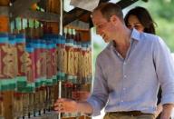 Britain's Prince William, Duke of Cambridge and his wife Catherine, Duchess of Cambridge, spin prayer wheels at the Paro Taktsang Monastery, Bhutan, April 15, 2016. REUTERS/Mark Large/Pool