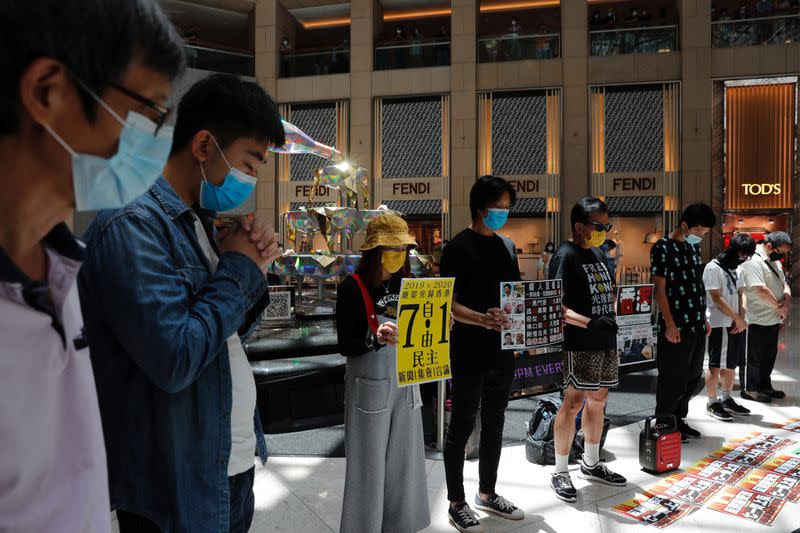 Pro-democracy protesters observe a minute of silence during a protest after China's parliament passes a national security law for Hong Kong