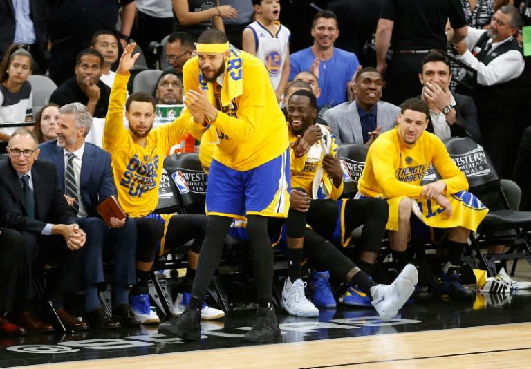 (From L) Stephen Curry, JaVale McGee, Draymond Green and Klay Thompson of the Golden State Warriors react on the bench during Game Four of the 2017 NBA Western Conference finals against the San Antonio Spurs, in San Antonio, Texas, on May 22