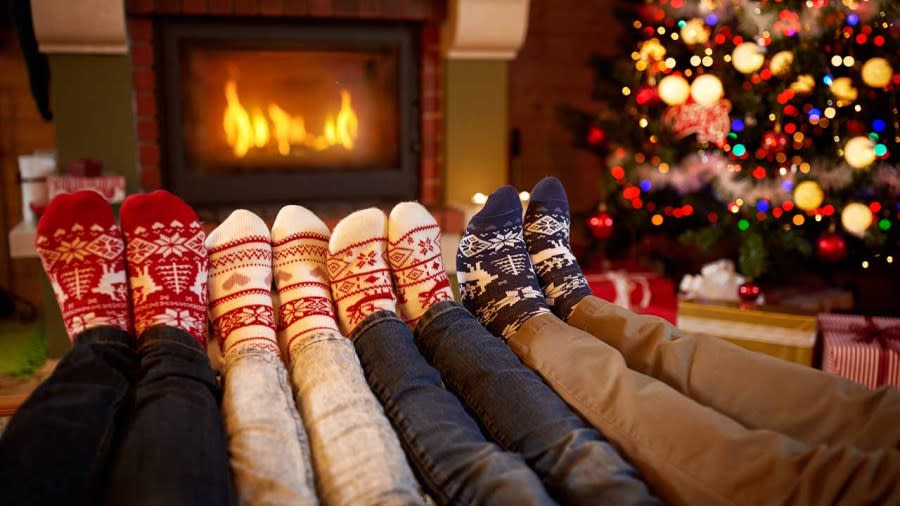 Pictured: Four people who have grown to love their annual Christmas socks. (Getty Images)