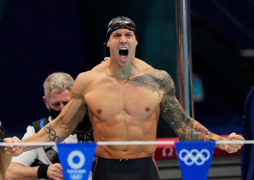 Caeleb Dressel (USA) celebrates after winning the men's 4x100m medley final during the Tokyo 2020 Olympic Summer Games at Tokyo Aquatics Centre.