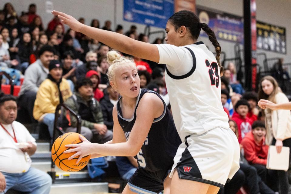 Salem Hills Skyhawks’ Bri Frampton (5) looks to pass the ball past West Panthers guard/forward Tia Pan (23) during a game at West High School in Salt Lake City on Thursday, Feb. 22, 2024. | Marielle Scott, Deseret News