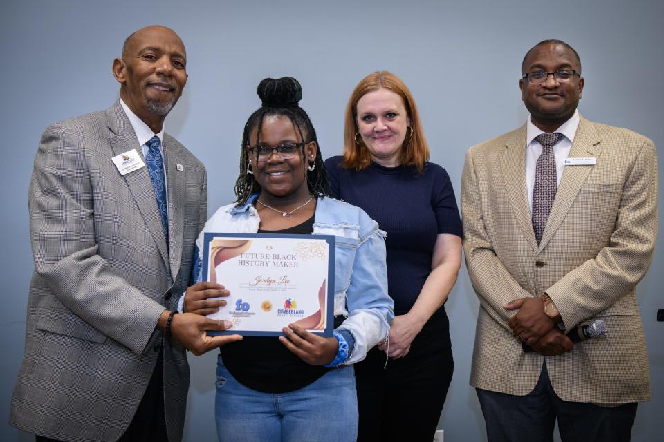 Jordyn Lee, 11, receives a certificate for being named one of the Future Black History Makers during a ceremony at Cape Fear Regional Theatre on Monday, Jan. 29, 2024. Pictured with Cumberland County Schools Superintendent Dr. Marvin Connelly, Jr., left to right, Fayetteville Observer News Director Beth Hutson and Fayetteville Observer opinion editor Myron B. Pitts.