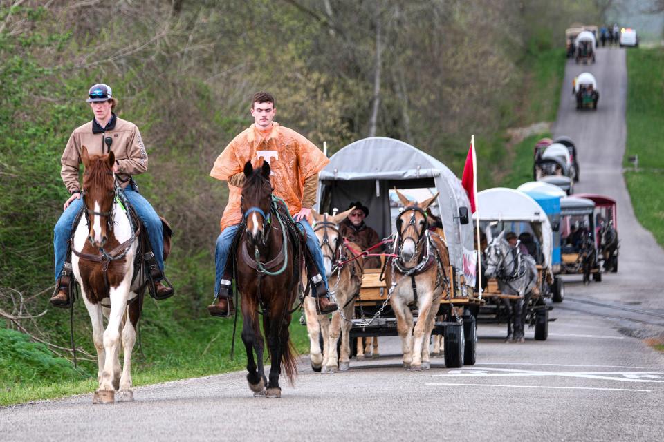The Mule Day Wagon Train heads down Hicks Lane on the way to Maury County Park in Maury County on April 3.