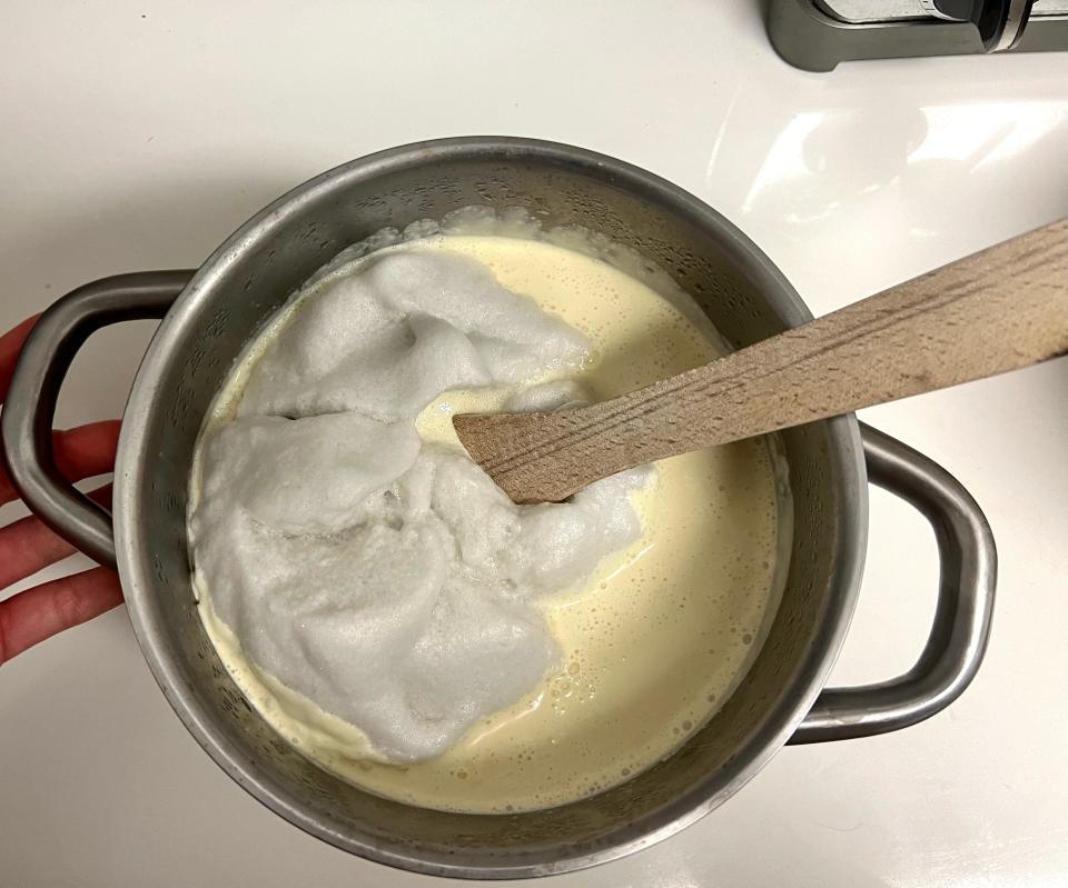 Adding the whipped egg whites into the mixture.