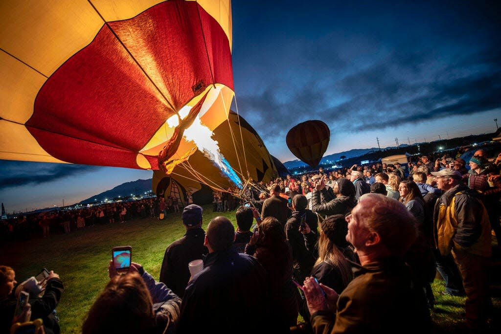 In this Oct. 5, 2019, file photo, a balloon is inflated at the 2019 Albuquerque International Balloon Fiesta in Albuquerque, N.M. Organizers had to cancel this year's event due to the coronavirus pandemic, but Mayor Tim Keller said Wednesday, Sept. 23, 2020, he wants to keep the tradition alive for residents. So local pilots are being invited to launch from city parks, golf courses and other open spaces from Oct. 3-11.