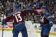 Colorado Avalanche right wing Valeri Nichushkin celebrates his goal against the Tampa Bay Lightning with right wing Mikko Rantanen during the second period in Game 2 of the NHL hockey Stanley Cup Final, Saturday, June 18, 2022, in Denver. (AP Photo/John Locher)