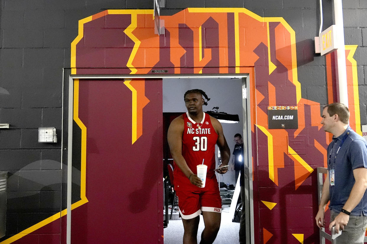 NC State forward DJ Burns Jr. exits the interview room ahead of a Final Four college basketball game in the NCAA Tournament, Thursday, April 4, 2024, in Glendale, Ariz. NC State plays Purdue on Saturday. (AP Photo/Brynn Anderson )