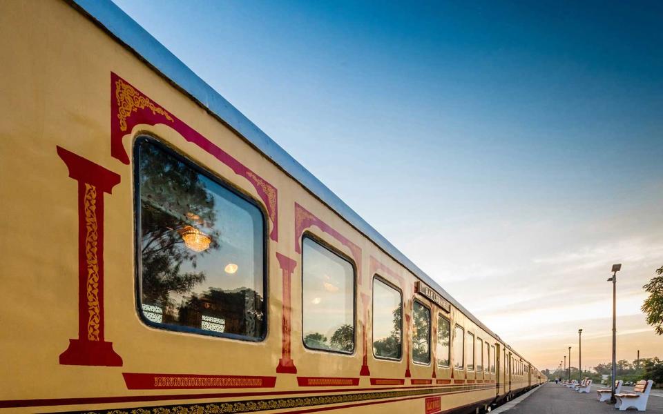 Exterior of the Palace on Wheels luxury train in India, painted in its signature cream and red