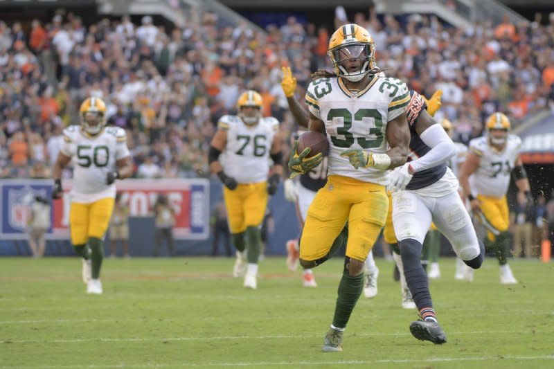 Green Bay Packers running back Aaron Jones (33) runs for a touchdown against the Chicago Bears on Sunday at Soldier Field in Chicago. Photo by Mark Black/UPI