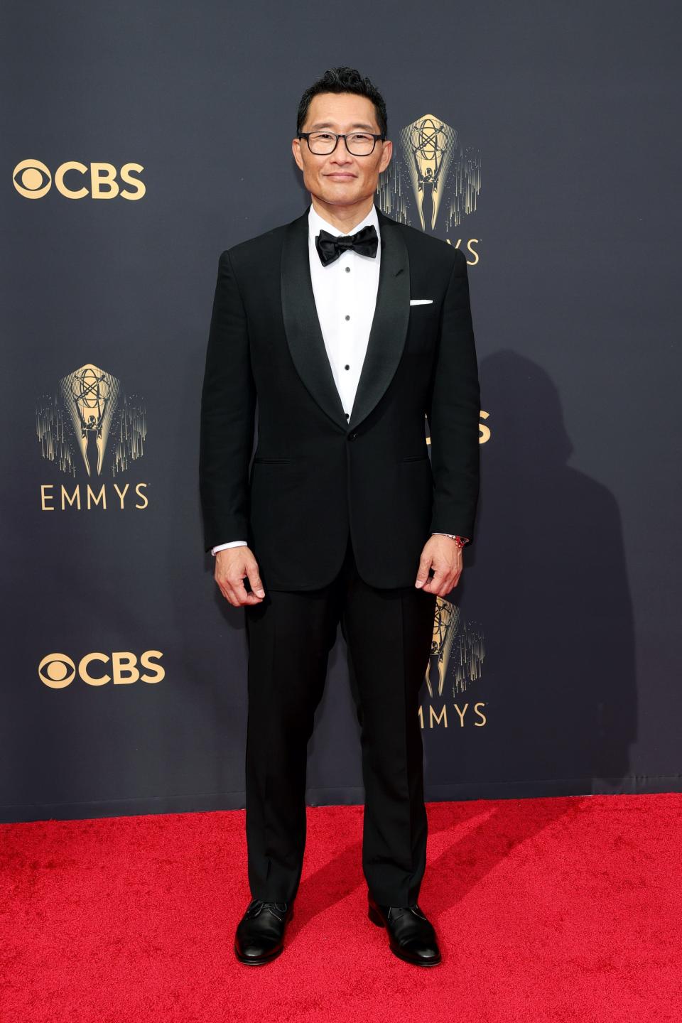 Daniel Dae Kim wears a black suit on the Emmys red carpet.