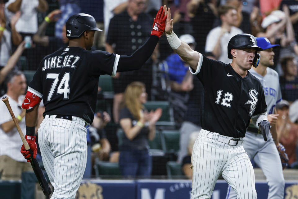 Chicago White Sox's Romy Gonzalez, right, celebrates with Eloy Jimenez after scoring against the Kansas City Royals during the seventh inning of a baseball game Wednesday, Aug. 31, 2022, in Chicago. (AP Photo/Kamil Krzaczynski)