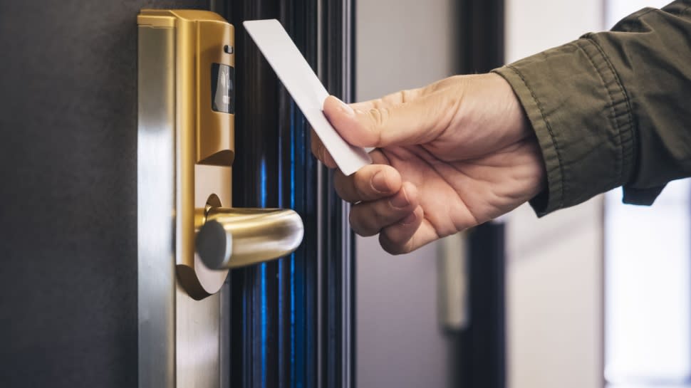  Hotel keycard opening door. 