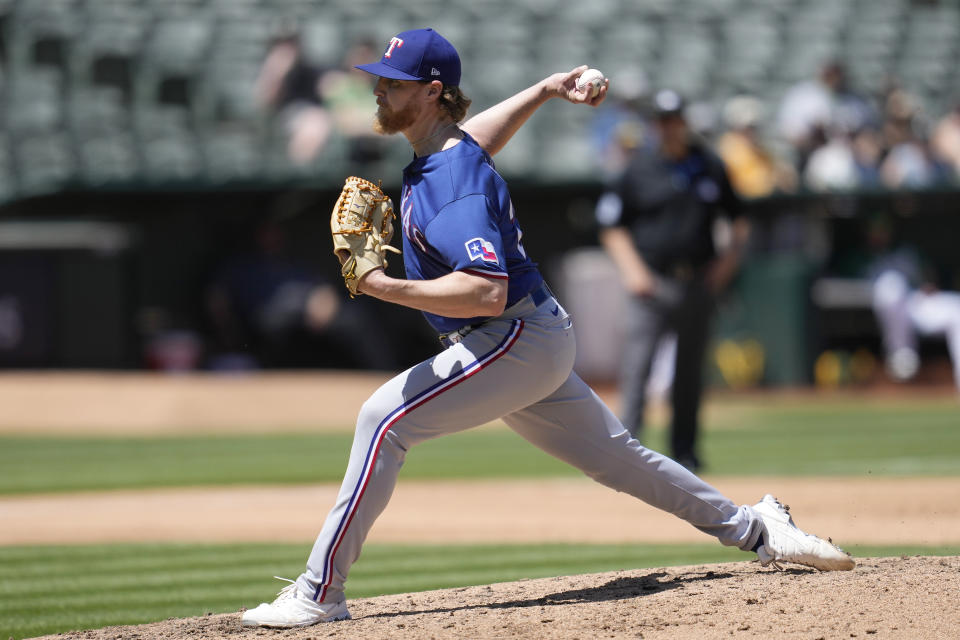 Texas Rangers pitcher Jon Gray works against the Oakland Athletics during the fifth inning of a baseball game in Oakland, Calif., Saturday, May 13, 2023. (AP Photo/Jeff Chiu)