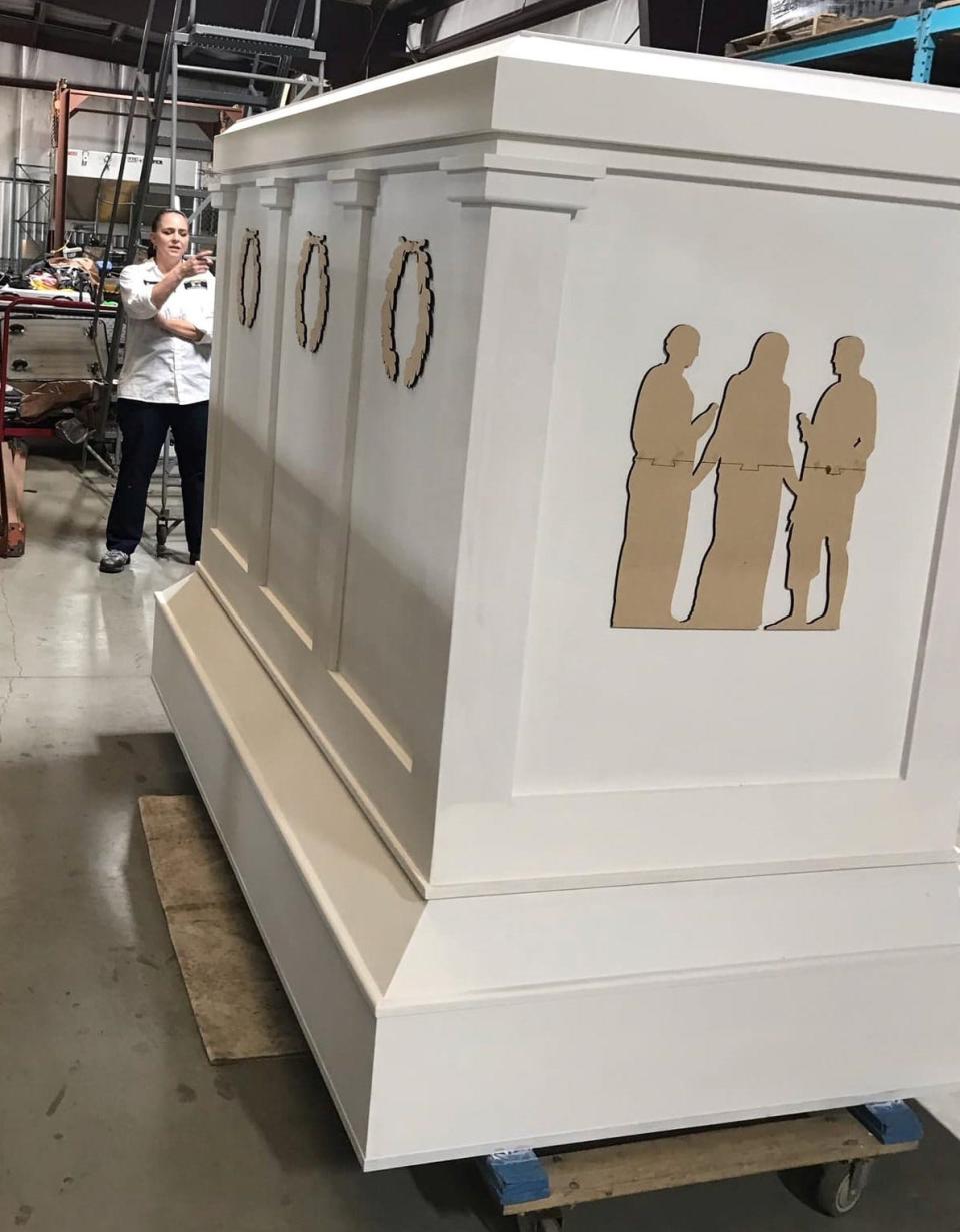 Joann Cecil with Chesterfield County General Services stands by the Tomb of the Unknown Soldier replica before she marbleizes it.