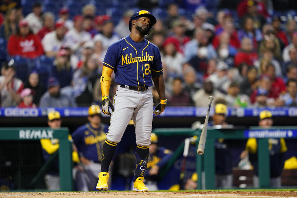 Milwaukee Brewers' Andrew McCutchen reacts after striking out against Philadelphia Phillies pitcher Aaron Nola during the third inning of a baseball game, Sunday, April 24, 2022, in Philadelphia. (AP Photo/Matt Slocum)