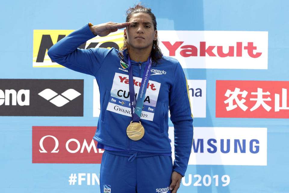 Gold medalist Ana Marcela Cunha of Brazil stands with her medal after the women's 5km open water swim at the World Swimming Championships in Yeosu, South Korea, Wednesday, July 17, 2019. (AP Photo/Mark Schiefelbein)