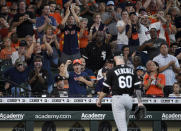 Fans cheer as Chicago White Sox starting pitcher Dallas Keuchel (60) walks to the dugout after being removed from the baseball game during the third inning against the Houston Astros, Sunday, June 20, 2021, in Houston. (AP Photo/Eric Christian Smith)