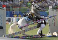 <p>Ilke Ozyusel of Turkey falls during equestrian portion of the women’s modern pentathlon at the Summer Olympics in Rio de Janeiro, Brazil, Friday, Aug. 19, 2016. (AP Photo/Kirsty Wigglesworth) </p>