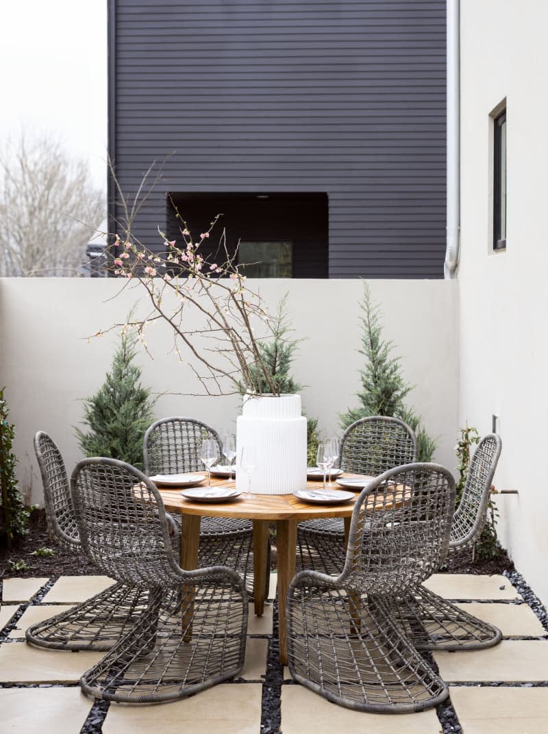 <span>Serenbe is all about connecting with nature, so outdoor living was key. The courtyard features pieces from <a href="https://www.universalfurniture.com/collection/coastal%20living%20outdoor" rel="nofollow noopener" target="_blank" data-ylk="slk:Universal Furniture’s Coastal Living collection,;elm:context_link;itc:0;sec:content-canvas" class="link ">Universal Furniture’s Coastal Living collection,</a> including the Chesapeake Round Dining Table and Del Mar Dining Chairs. Credit: <a href="https://www.jonasjungblutphoto.com/" rel="nofollow noopener" target="_blank" data-ylk="slk:Jonas Jungblut;elm:context_link;itc:0;sec:content-canvas" class="link ">Jonas Jungblut</a></span> <span class="copyright">Credit: <a href="https://www.jonasjungblutphoto.com/" rel="nofollow noopener" target="_blank" data-ylk="slk:Jonas Jungblut;elm:context_link;itc:0;sec:content-canvas" class="link ">Jonas Jungblut</a></span>