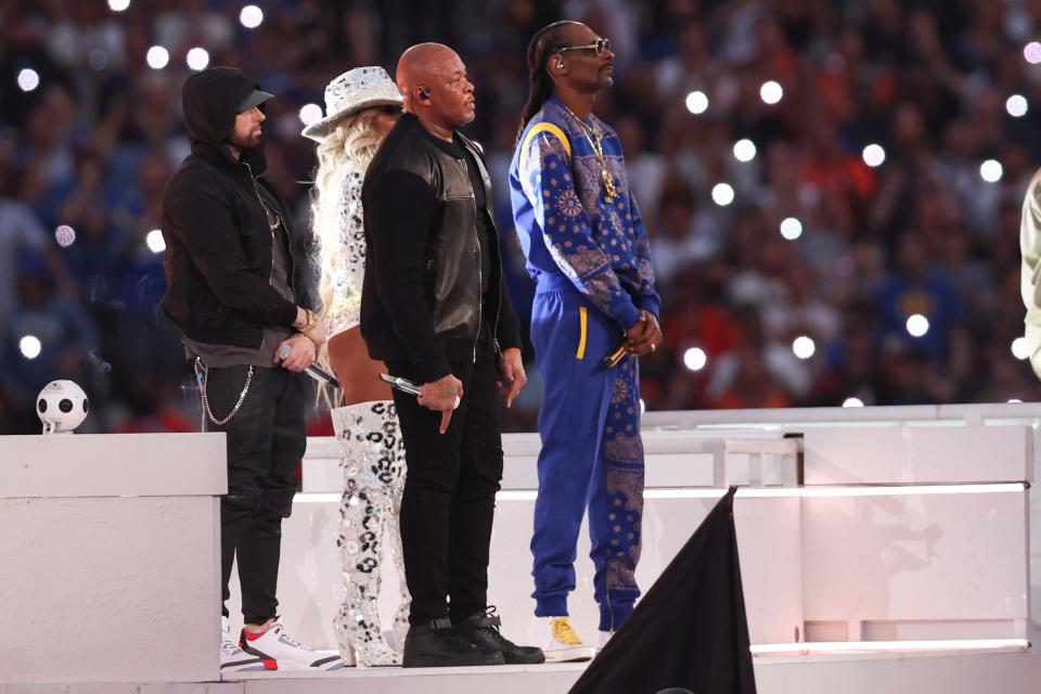 Eminem (left) and Snoop Dogg (right), with Dr. Dre and Mary J. Blige, conclude their Super Bowl halftime show at SoFi Stadium on Feb. 13, 2022 in Inglewood, Calif.