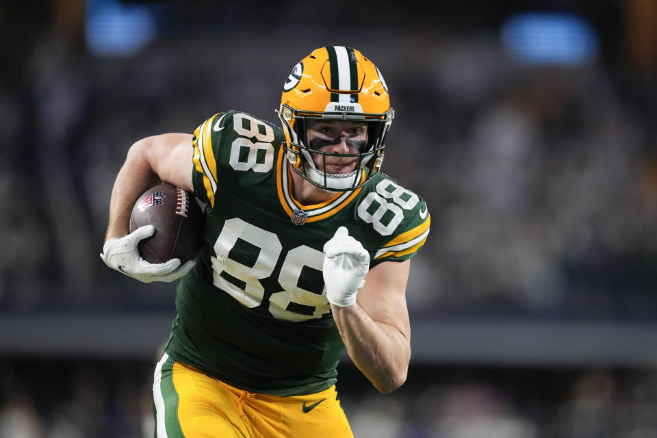 Green Bay Packers tight end Luke Musgrave runs in a touchdown after making a catch against the Dallas Cowboys during the second half of an NFL football game, Sunday, Jan. 14, 2024, in Arlington, Texas. (AP Photo/Sam Hodde)