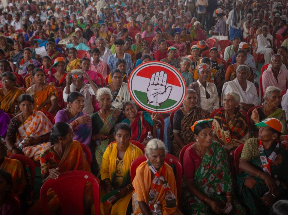 Supporters of the opposition Congress party attend an election rally addressed by party leader Rahul Gandhi in Mandya, on 17 April 2024 (Getty Images)
