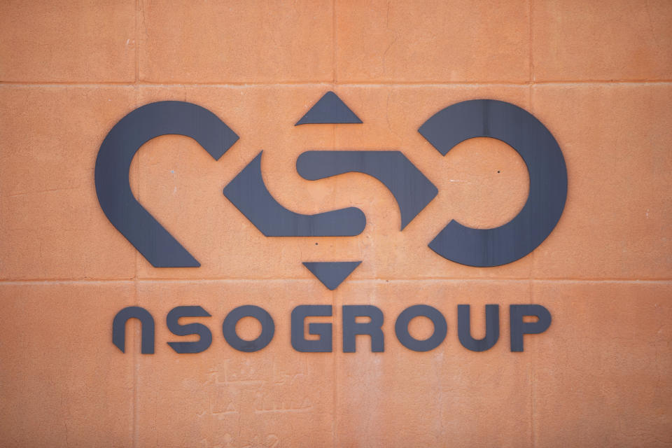 FILE - A logo adorns a wall on a branch of the Israeli NSO Group company, near the southern Israeli town of Sapir, Aug. 24, 2021. The best known example of spyware, the Pegasus software from Israel's NSO Group, was used to target more than 1,000 people across 50 countries, according to security researchers and a July 2021 global media investigation, citing a list of more than 50,000 cellphone numbers. The U.S. has already placed export limits on NSO Group, restricting the company's access to U.S. components and technology. (AP Photo/Sebastian Scheiner, File)