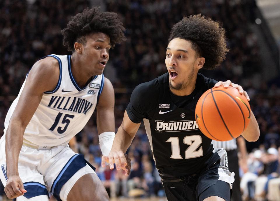 Mar 1, 2022; Villanova, Pennsylvania, USA; Providence Friars guard Brycen Goodine (12) drives with the ball against Villanova Wildcats guard Jordan Longino (15) during the first half at William B. Finneran Pavilion. Mandatory Credit: Bill Streicher-USA TODAY Sports