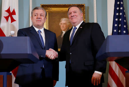 U.S. Secretary of State Mike Pompeo shakes hands with Georgia's Prime Minister Giorgi Kvirikashvili after delivering remarks at their Georgia Strategic Partnership meeting at the State Department in Washington, U.S., May 21, 2018. REUTERS/Leah Millis